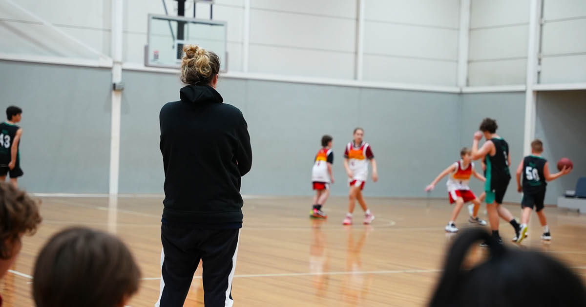 Coach watching over court